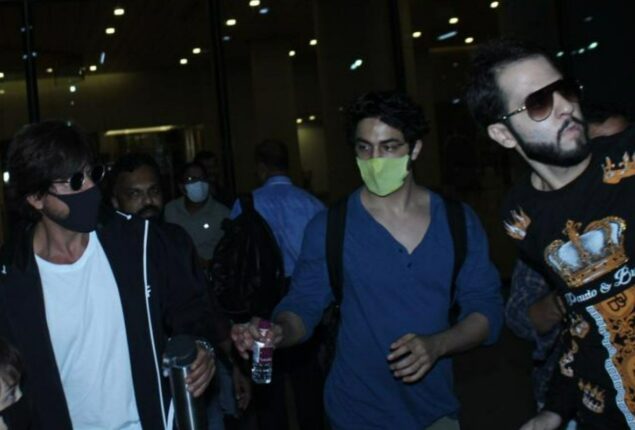 Shah Rukh Khan shrugs off as fan holds his hand at airport