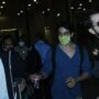 Shah Rukh Khan shrugs off as fan holds his hand at airport