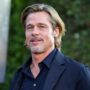 Brad Pitt surprises his co-stars from “Bullet Train” by going shirtless for interview