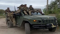 Ukrainians give soldiers hugs, congratulating them for liberating their village