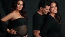 Bipasha Basu cradles bare baby bump in a sheer black gown