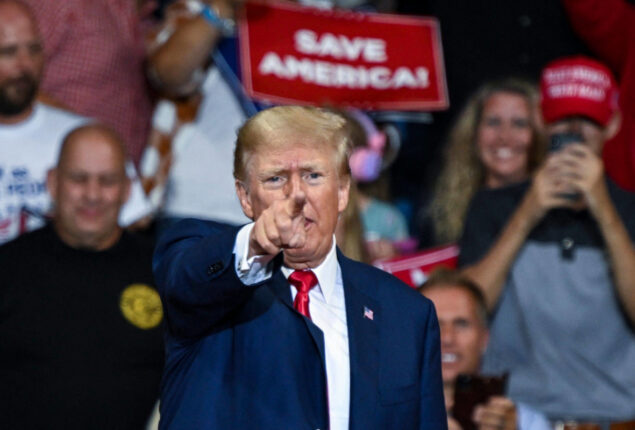 On his social media, Trump promotes QAnon-related posts