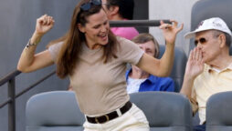 Jennifer Garner shows no sign of despair as she dances off during football match