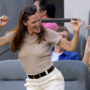 Jennifer Garner shows no sign of despair as she dances off during football match