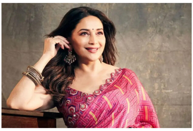Madhuri Dixit looks transcendent as she smiles and poses in a pink saree