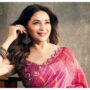 Madhuri Dixit looks transcendent as she smiles and poses in a pink saree