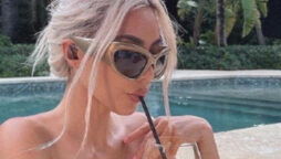 Kim Kardashian accuses of photo shop her poolside neck muscle