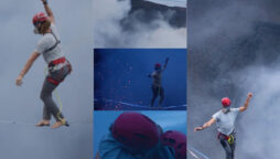 Adventure-seekers do slackline walk over active volcano