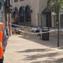 Component of a building collapses into a city street in Leicester