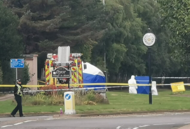 Woman found dead at roundabout, man arrested