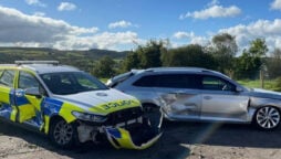 Tractor rams police cars, thwarting murder arrest