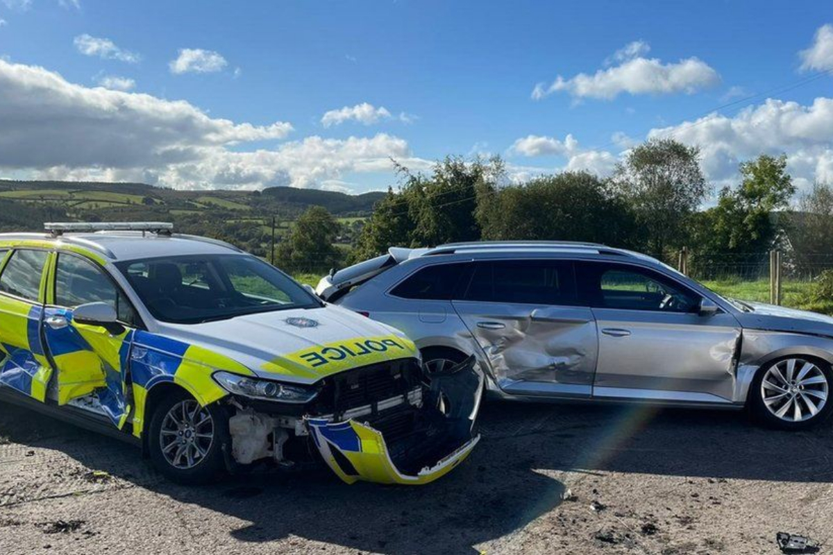 Tractor rams police cars