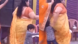 Aunty falls over a little boy while dancing to Haryanvi song 