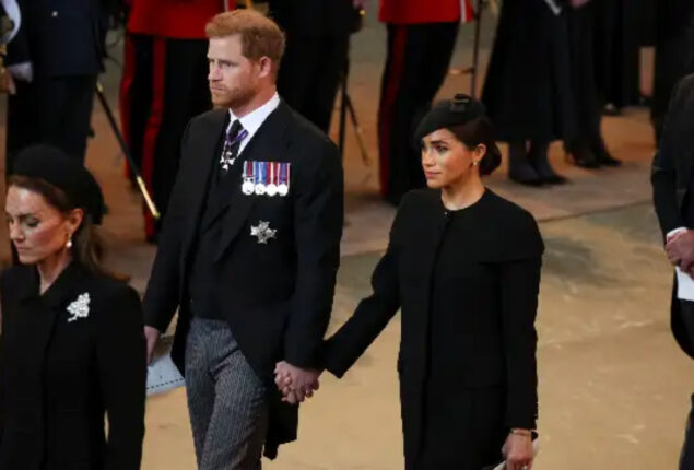 Prince Harry and Meghan Markle hold hands at Queen’s funeral
