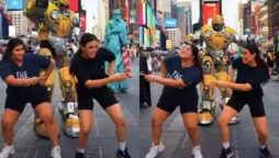 Indian Women Perform Bhangra in Times Square with Bumblebee Robot
