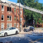 After a nearby explosion, a building collapses in Chicago