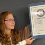 A teenager sets Guinness World Record for number of socks worn in 30 seconds