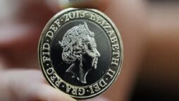 Unveiling of a new coin with a picture of Queen Elizabeth