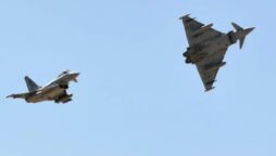 China-based former US military pilot detained in Australia