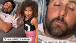 Young girl applying cosmetics
