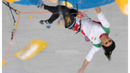 Iranian rock climber returns to Tehran after competing hijab-free