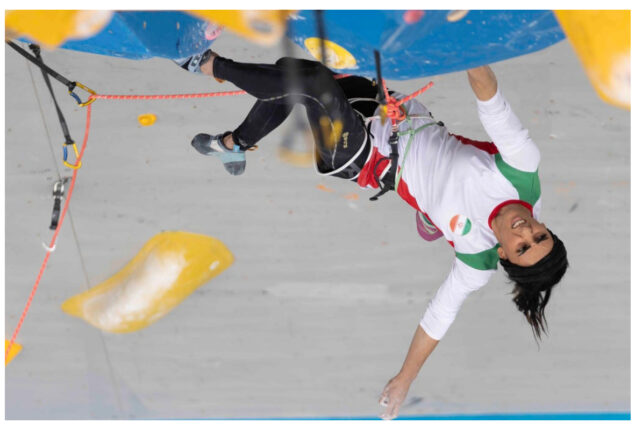 Iranian rock climber returns to Tehran after competing hijab-free