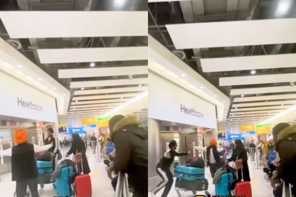 Men start bhangra dance after meeting at Heathrow airport
