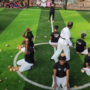 Martial artist smash coconuts with nunchaku on volunteers’ heads