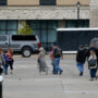 Man charged with murder in hotel shooting in Michigan