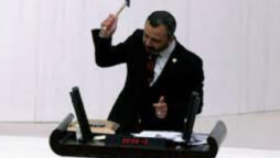 Turkey MP Burak Erbay hammers phone in parliament
