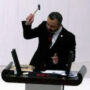Turkey MP Burak Erbay hammers phone in parliament