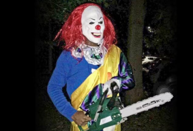 Killer clown jumps out to terrify underpass walkers with “chainsaw”
