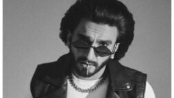 Ranveer Singh wears a black leather jacket and cool sunglasses