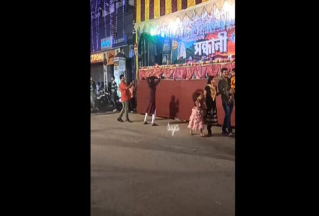 Woman dances to Yaad Aa Raha Hai Tera Pyar near a puja pandal