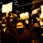 China curbs protesters, modifies COVID