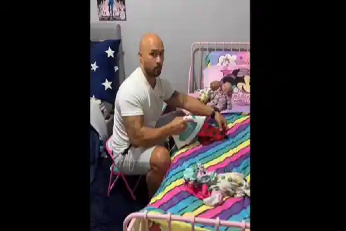 Ironing his daughter