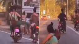 Viral Video: Woman fall off bike after trying to kick other rider