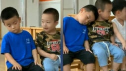 Cute little boy lends shoulder to sleepy friend: Watch