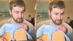 Man putting baby to sleep on guitar is perfect timeline cleaner