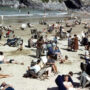 Man holding phone in 1940s beach photo proves time travel is real