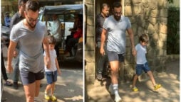 Saif Ali Khan holds son Taimur Ali Khan’s hand as they step out