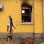 Ukrainians try to steal Banksy’s gas-mask lady mural