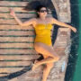 Priyanka Chopra in yellow swimsuit as she lounges on yacht