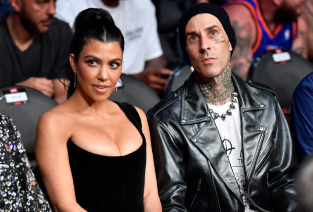Kourtney Kardashian dazzles at christmas party with Travis Barker and Kids