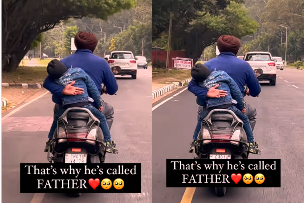 Man riding scooter with young boy