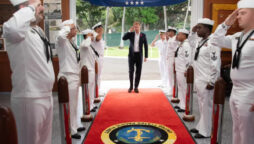 Prince Harry Salutes Navy Servicemen at Pearl Harbor Photos