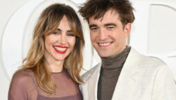 Robert Pattinson walks the red carpet with his girlfriend Suki Waterhouse