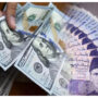 Rupee continues to slide against dollar