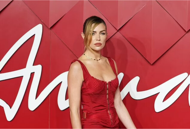 Abbey Clancy shows off her slim figure in bright red dress at British Fashion Awards