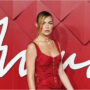 Abbey Clancy shows off her slim figure in bright red dress at British Fashion Awards